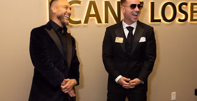 Mike Sorrentino and family at The Archangel Centers photo wall during the grand opening