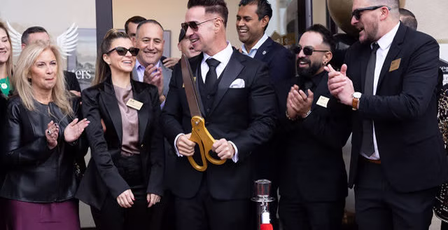 Ribbon-cutting moment at The Archangel Centers grand opening, second angle